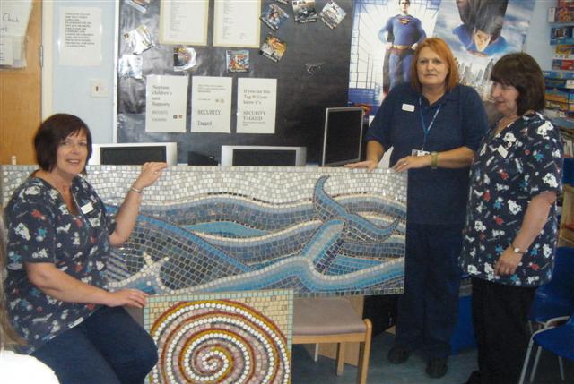 Nurses admiring a mosaic